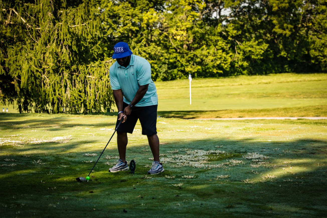 Golfer teeing off during the scramble
