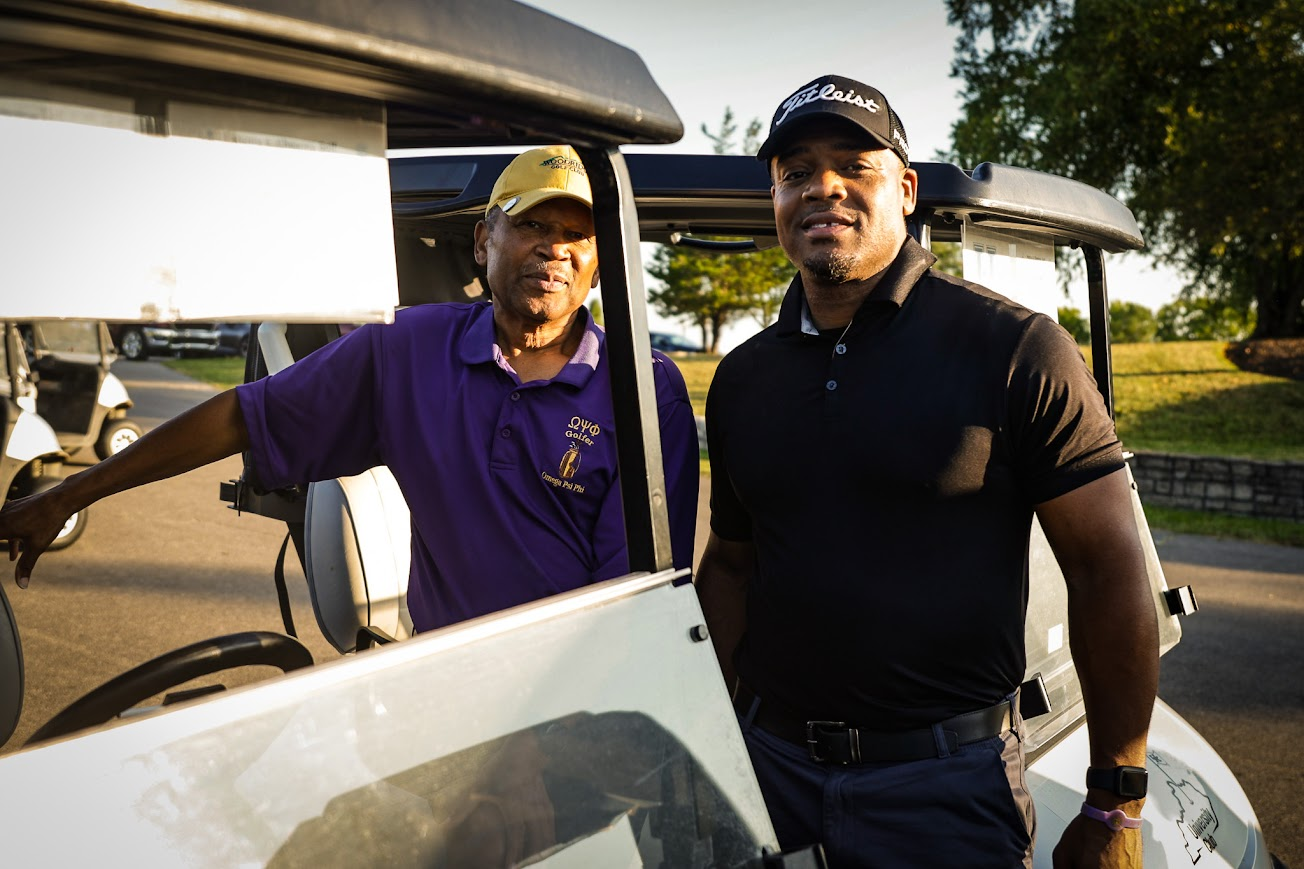 Golfers by the cart