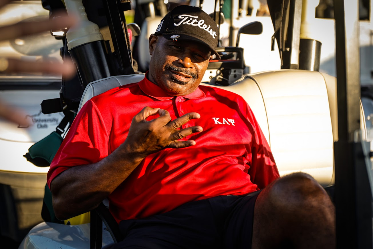 Golfer relaxing in cart